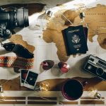 black DSLR camera near passport