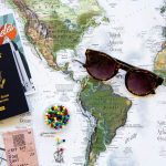 brown framed sunglasses on map