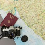 black and silver nikon dslr camera on red book