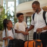 Family hotel stay with parents and children in a practical guest room