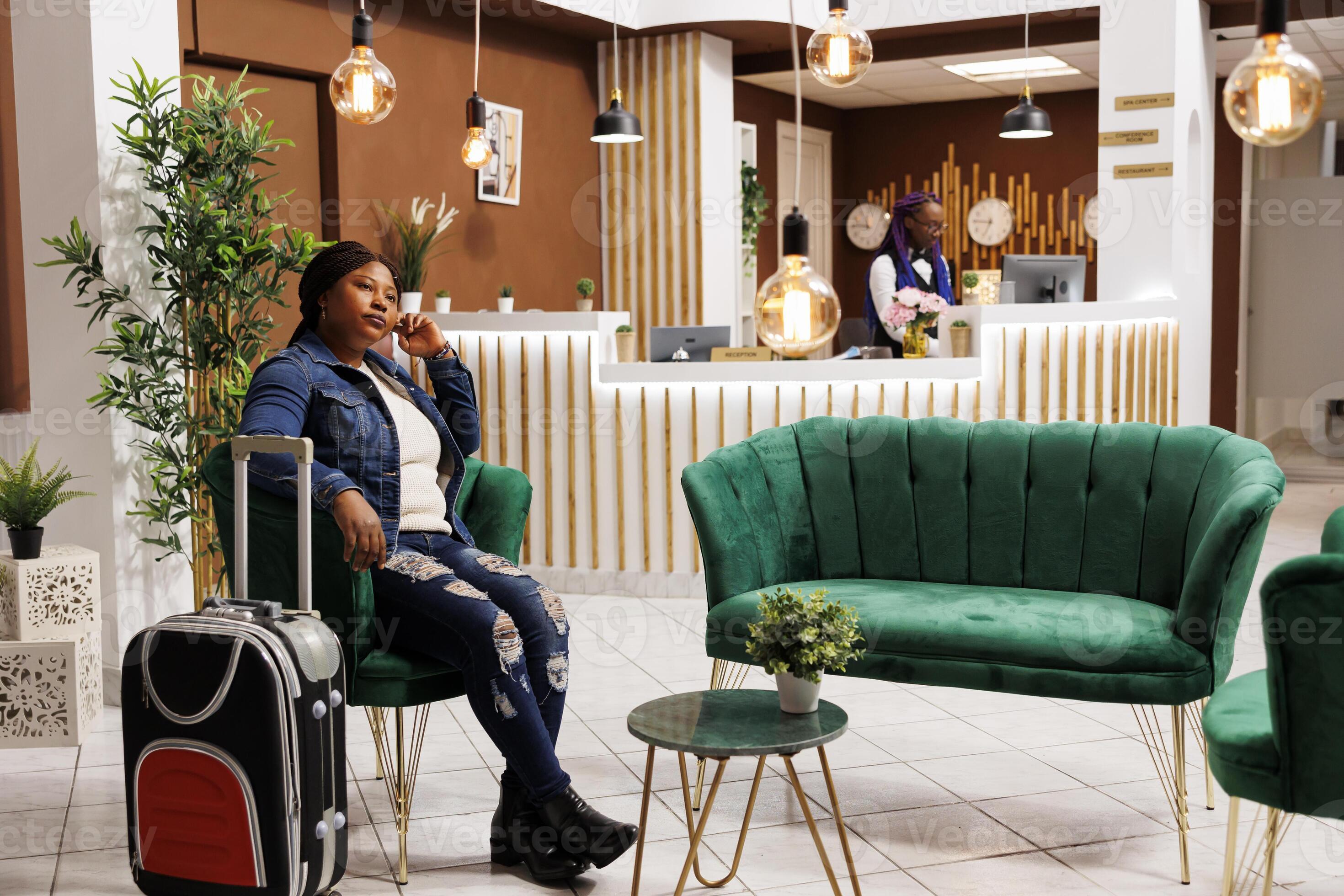 Traveler arriving at a hotel after confirming room and check-in details