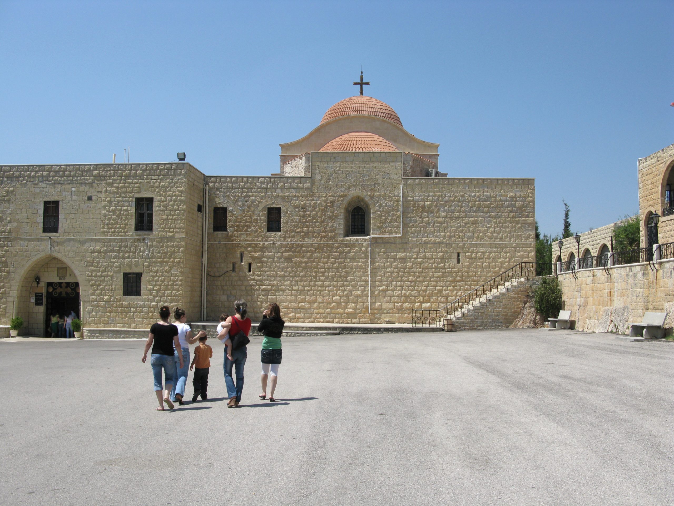 Traveler following photography rules at an active religious site