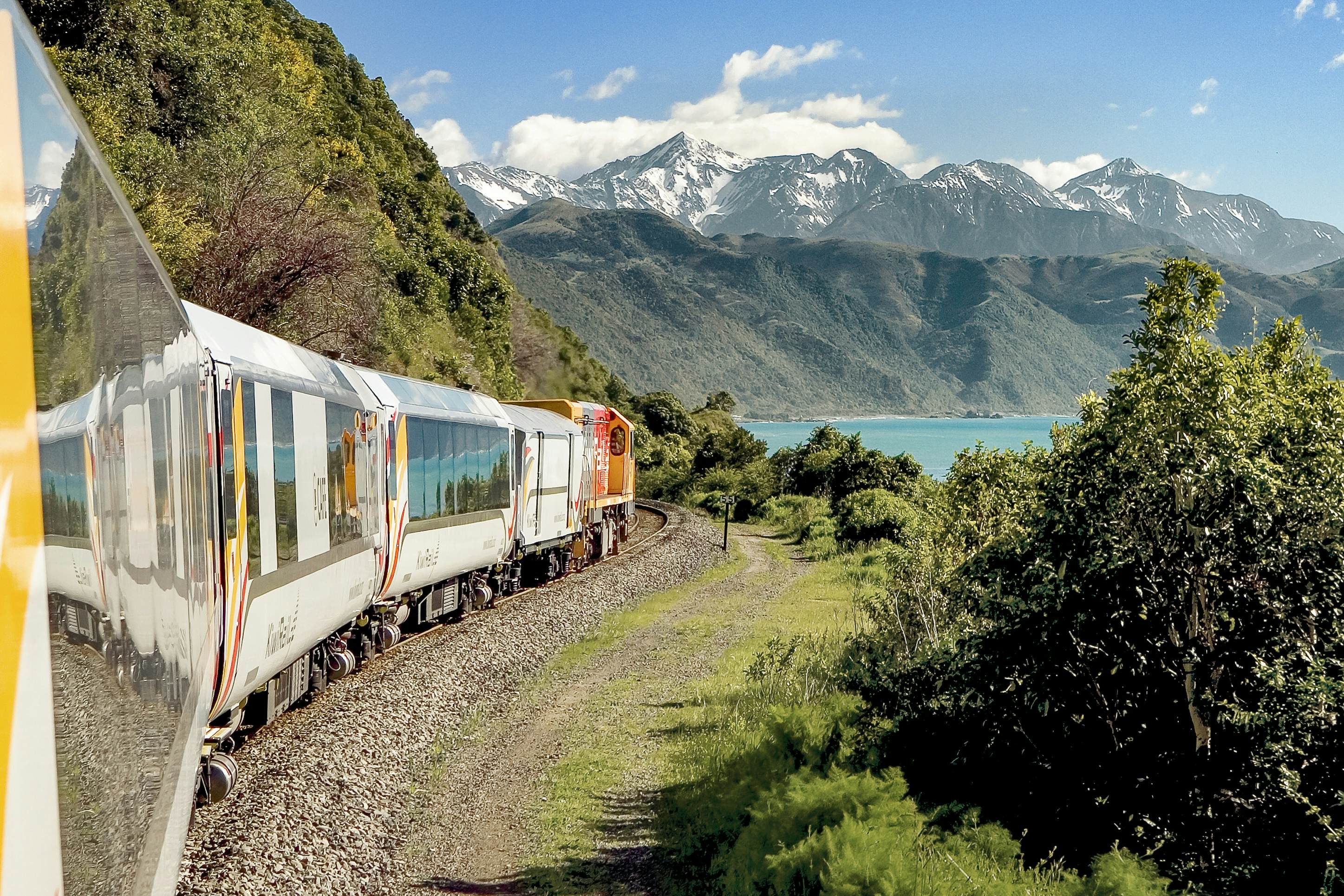Scenic train journey through mountain landscapes as the center of a rail vacation