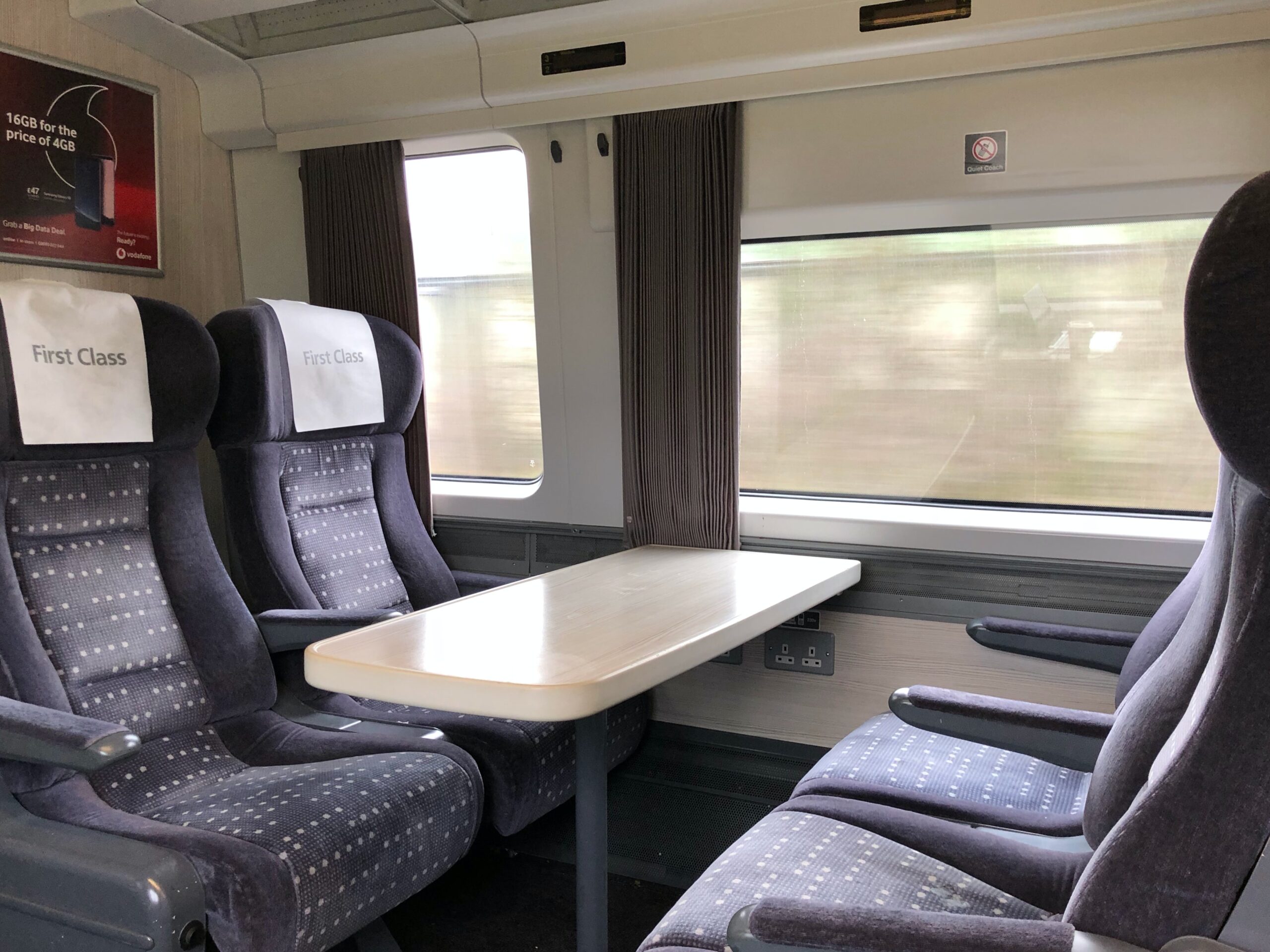 Rail ticket and seat reservation details checked before a scenic train journey